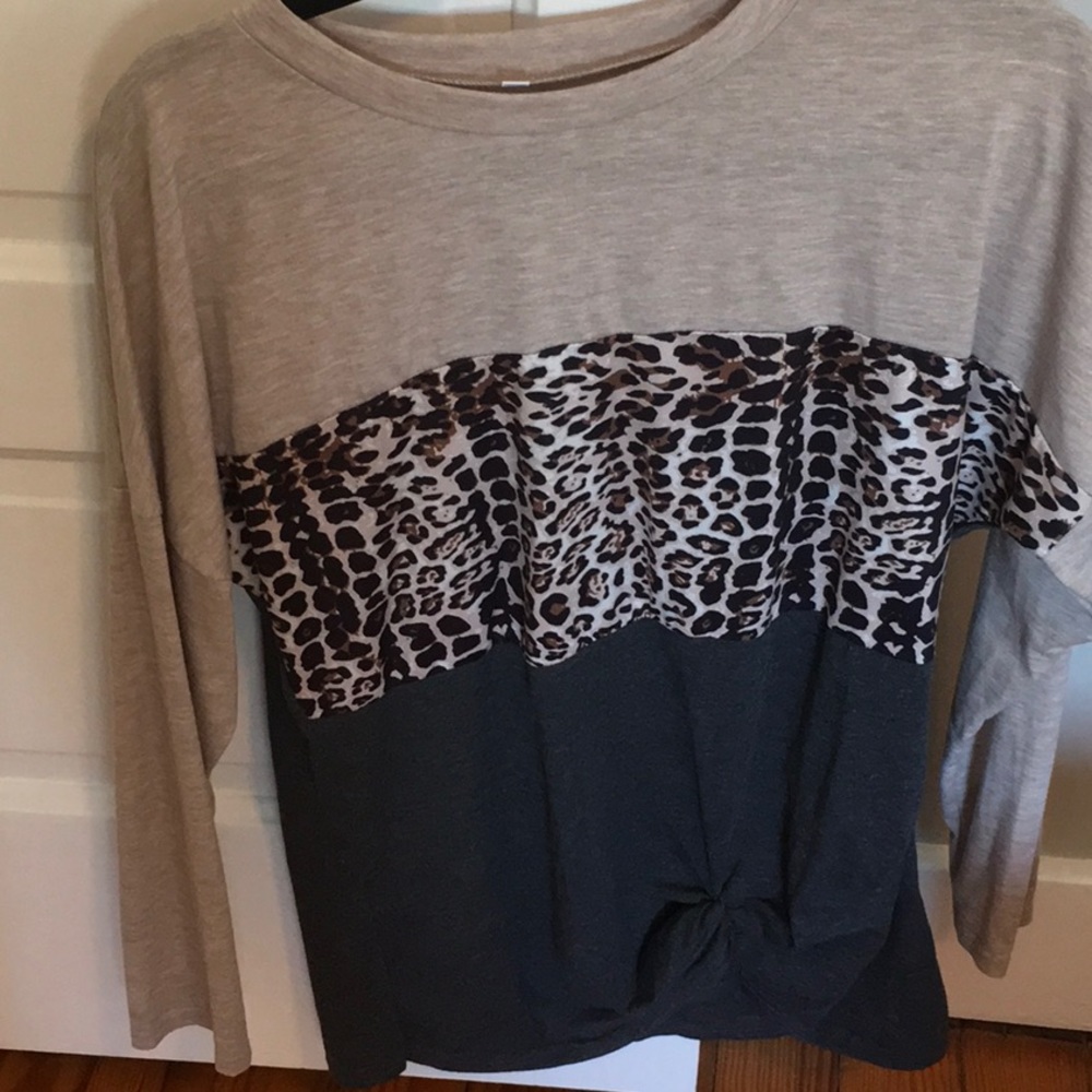 Women’s cotton knit top with animal print detail. Worn 1X. Size small